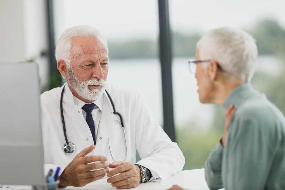 A dentist explaining a treatment plan to a patient